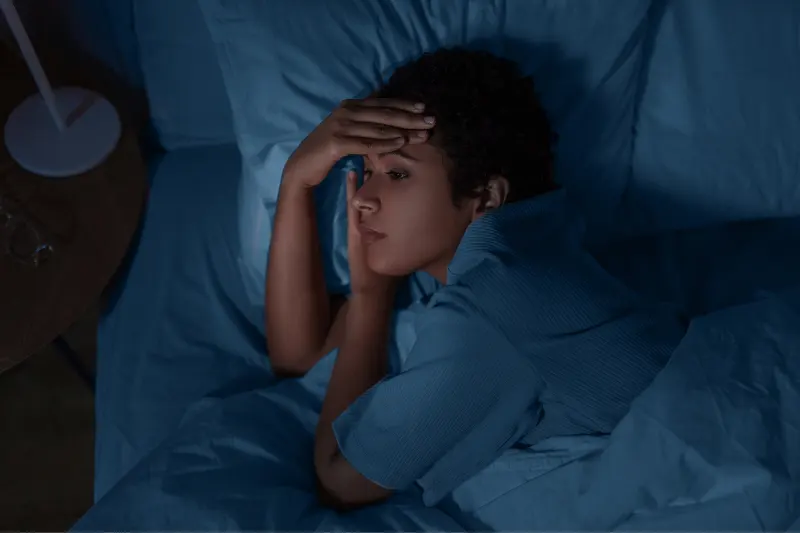 Sleepless_nights1 A lady whos in bed and struggling to fall asleep